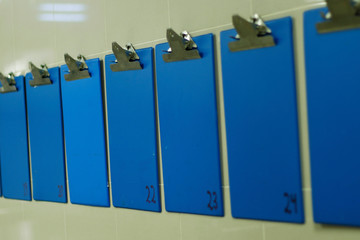 blue color information clip board on wall