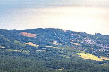view from Mount Ai-Petri in Crimea forest, mountains and sea at sunrise