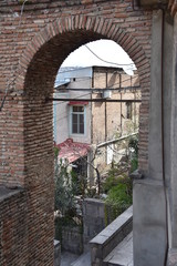 Fototapeta premium Looking Down Through Brick Arch, Betlemi Rise, Tbilisi, Georgia