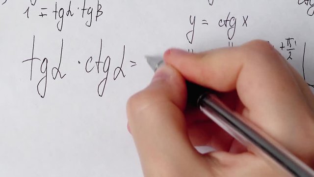 Writing of mathematical formulas on paper. Work of the mathematician.