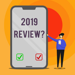 Word writing text 2019 Review Question. Business photo showcasing remembering past year events main actions or good shows Man Presenting Huge Blank Screen Smartphone while Holding Another Mobile