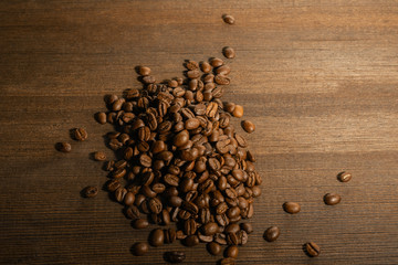 coffee fried beans, on an old wooden background