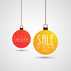 Sale text on hanging christmas ball for Christmas celebration.