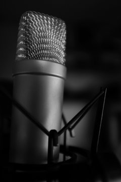 condensor microphone in studio black and white image