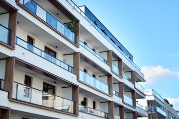 Multistory new modern apartment building. Stylish living block of flats.