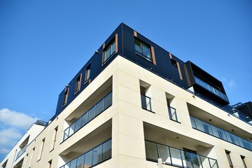 Multistory new modern apartment building. Stylish living block of flats.