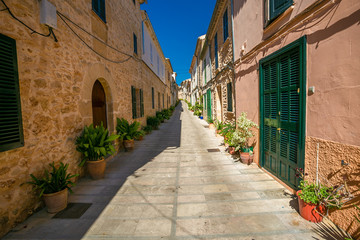 Fototapeta na wymiar Narrow street in old town of historic Alcudia. Majorca. Spain.