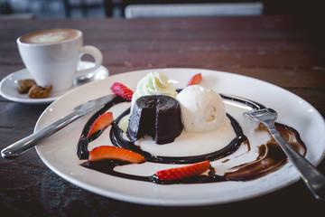hot chocolate lava cake with vanilla ice cream and fresh strawberry