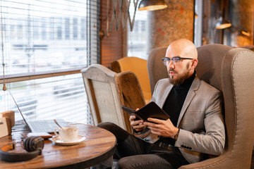 Electronic menu or bill in the restaurant in the form of a smartphone tablet, with built-in...