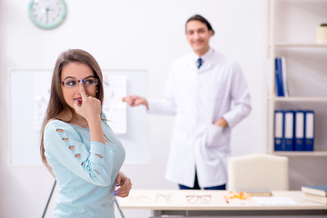 Young woman visiting male doctor oculist 