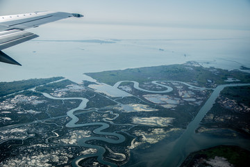 Naklejka premium Beautiful view from the plane to the swampy places near Venice, Italy