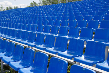 empty spectator seats in the open-air arena