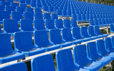 empty spectator seats in the open-air arena