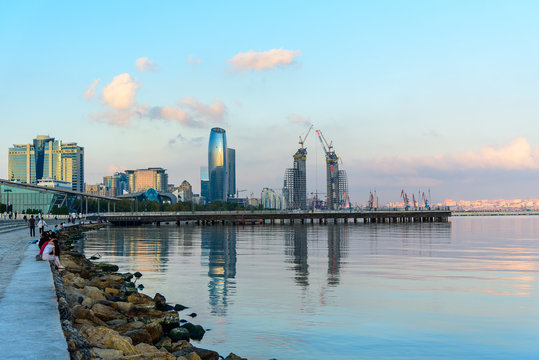 view of the coast of the Caspian sea at sunset, urban landscape.