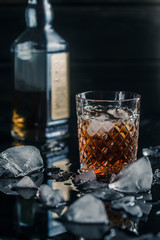 alcoholic whiskey drink in an ice glass