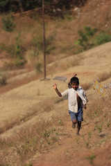 indian child playing with kite