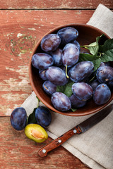 ripe plums on the table.