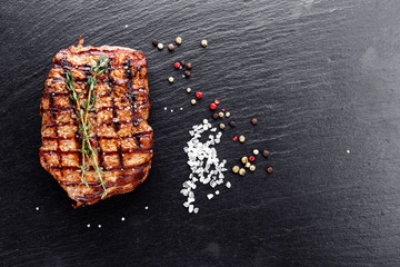 Cooked steak with seasonings and sauces