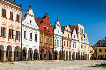 Main square of Telc city, a UNESCO World Heritage Site, on a sunny day with blue sky and clouds, South Moravia, Czech Republic.