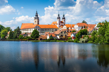 Fototapeta na wymiar View of Telc across pond with reflections, Unesco world heritage site, South Moravia, Czech Republic.