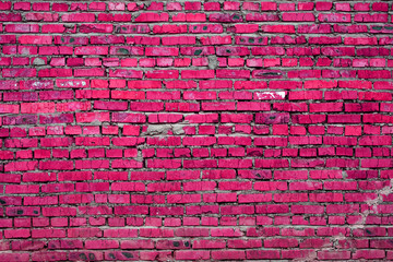 A old brick wall with cracks. Abstract background. Toned. Texture