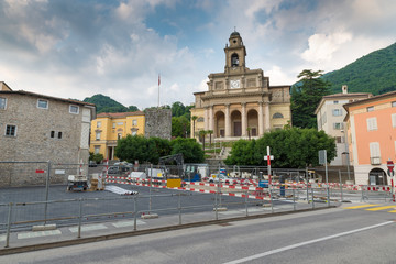 Urbanization works in the historic center of a Swiss city. Mendrisio and in the background the church of Santi Cosma e Damiano, square del Ponte