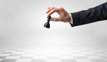 Big elegant hand taking his next step on chess game  © ra2 studio