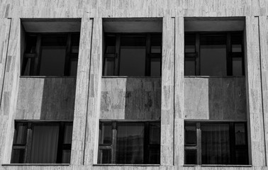 Old oak windows in row in black and white on the city hall.