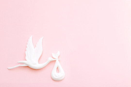 stork carries a baby in convolution, a symbol of motherhood, childbirth, birthday, place for text - Powered by Adobe