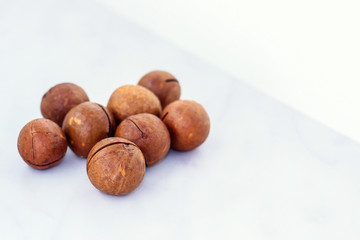 Ripe macadamia nuts close-up. healthy food, vitamins
