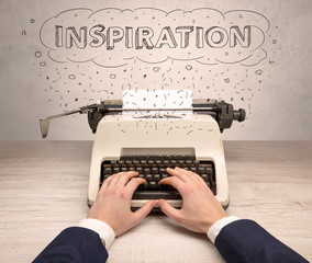 First person perspective hand writing on typewriter with cloud message concept
