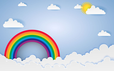 Cloud and Rainbow in the Blue sky with paper art style the concept is summer season