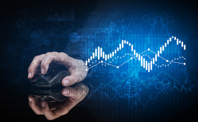Hand using wireless mouse with statistical concept on dark background
