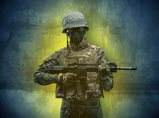 Hazard, menace soldier in a ruined crumbly building with arms on his hand
