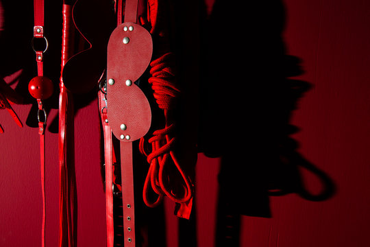 erotic games and human sexuality concept. kinky sex toys for  BDSM fantasy play (ball gag, cuffs, rope, flogger, collar and leash)
