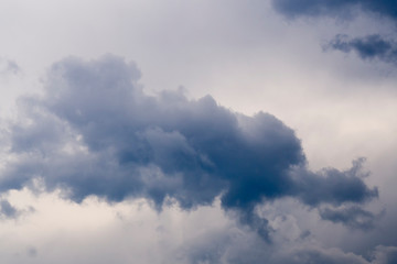 Fototapeta na wymiar Big cumulonimbus on blue sky. Cumulus, stratocumulus, stratus, altocumulus, nimbostratus. Dramatic sky with stormy clouds