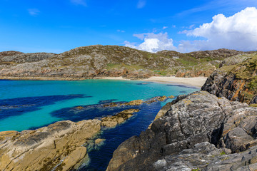 The small hidden beach near Achmelvich beach from the headland between them, Lochinver, Scotland, UK