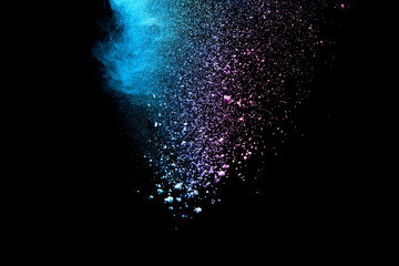 Multi color powder explosion isolated on black background. 