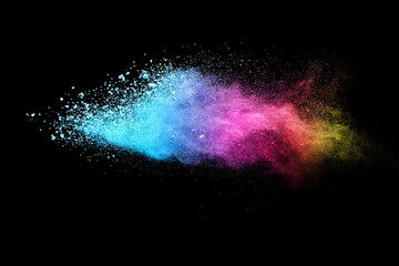 Multi color powder explosion isolated on black background. 