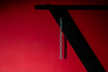  SM cross or Andreaskreuz is used in the BDSM scene on red background