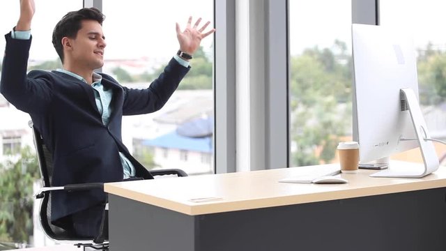 business man relaxing or sleeping after finished work put  feet on the desk in office. male boss worker close eyes sitting with legs on the table in the resting time at work place