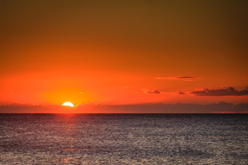 Fototapeta na wymiar Sunset or sunrise over sea surface