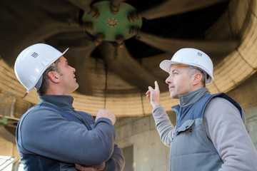 engineers discussing outside building site