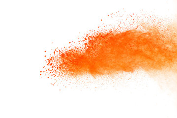 Orange powder explosion isolated on white background.