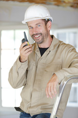 builder talking in walkie-talkie