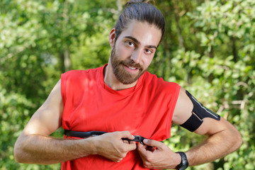 man running with heart rate monitor strapped across his chest