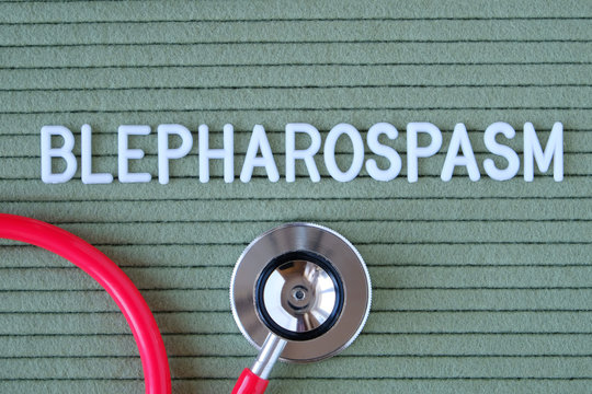 Blepharospasm- text from white letters on  green background with  stethoscope, medical concept diagnostics, treatment, healthcare.