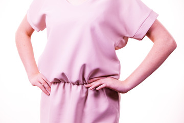 Female wearing casual pink tunic dress