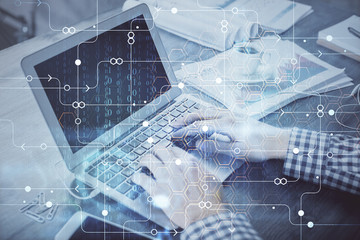 Double exposure of forex chart with man working on computer on background. Concept of market analysis.