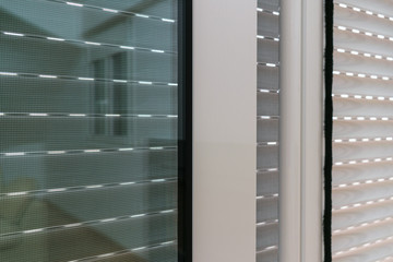 Aluminum sliding door with fly screen and rolling shutter detail